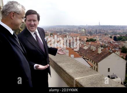 Czech Prime Minister Vladimir Spidla (L) listens to the NATO Secretary General Lord George Robertson on a balcony of the Hrzan Palace in Prague May 26, 2003. Lord Roberston arrived in Prague to attend the Spring Session of the NATO Parliamentary Assembly. REUTERS/Petr Josek  PJ