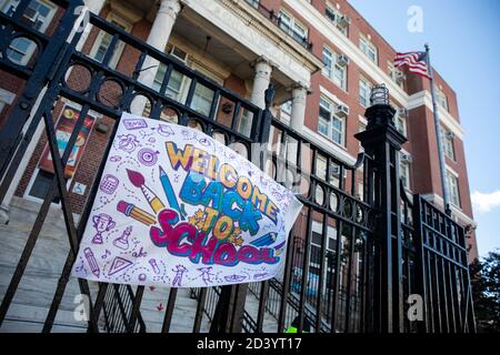 (201008) -- NEW YORK, Oct. 8, 2020 (Xinhua) -- A sign 'Welcome Back to School' is seen at the entrance of a closed public school in the Gravesend neighborhood, a COVID-19 hotspot area in Brooklyn of New York, the United States, on Oct. 8, 2020. The latest coronavirus positivity rate in the 20 hotspot ZIP codes in Queens, Brooklyn, Orange and Rockland counties in New York State was 5.8 percent, more than five times the statewide positivity rate excluding these ZIP codes which stood at 1.01 percent, tweeted Governor Andrew Cuomo on Thursday. Shutdowns of non-essential businesses, schools and soc Stock Photo