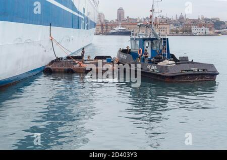 Marine vessel pumping out sewage from a ferry boat, Genoa, Liguria, Italy, Stock Photo