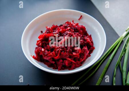 Step-by-step instructions for preparing a diet red borscht from chicken fillet. Step three - mixing vegetables and lighting them on sunflower oil, Stock Photo