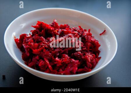 Step-by-step instructions for preparing a diet red borscht from chicken fillet. Step three - mixing vegetables and lighting them on sunflower oil, Stock Photo