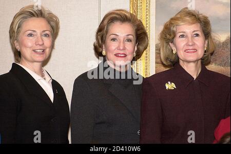 U.S. Senators Hillary Rodham Clinton, D-NY, Elizabeth Dole, R-NC and Kay Bailey Hutchison, R-TX (L-R), gather for a photo of newly-elected women members of the 108th Congress, January 9, 2003 on Capitol Hill. Dole, a former Cabinet official and head of the American Red Cross, joins a group that now totals 14 women. REUTERS/Mike Theiler  MT