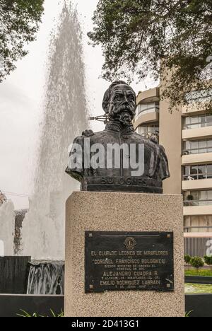 Lima, Peru - December 4, 2008: Roundabout called Ovalo Bolognesi. Closeup of statue  chest of Coronel Bolognesi on beige stone pedestal with tall whit Stock Photo