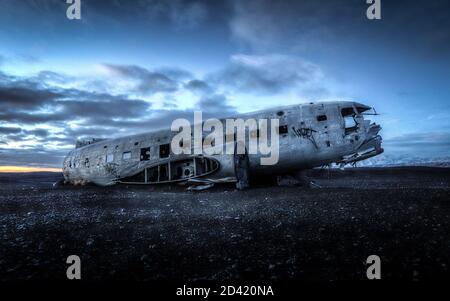 VIK, ICELAND - Dec 11, 2018: The wreck of a US Naval DC-3 aircraft forced to make an emergency landing sits abandoned on Iceland's Solheimasandur Beac Stock Photo