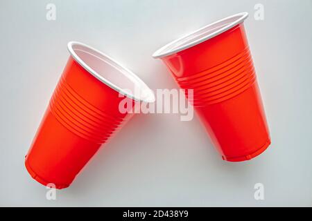 Close up to single use red plastic glass on a white background. Concept: Ban single use plastic Stock Photo