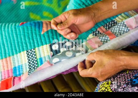 Quilt making in Caohagan Island off Cebu in the Phlippines Stock Photo