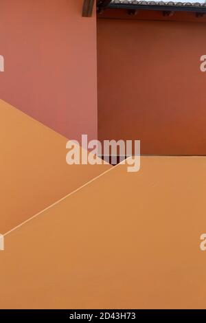 close-up to plain pink and orange wall, with straight lines, modern design Stock Photo