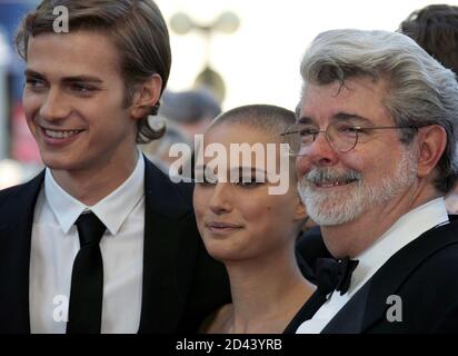 U.S. director George Lucas (R) poses with cast members Hayden Christensen and Natalie Portman during red carpet arrivals for the director's out of competition film 'Star Wars - Episode III - Revenge of the Sith' at the 58th Cannes Film Festival May 15, 2005.