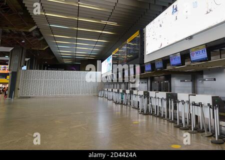 Empty airport check-in hall due to coronavirus. GRU Airport Terminal 2 without passengers. Sao Paulo Guarulhos Airport during covid 19 pandemic. Stock Photo