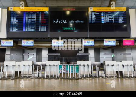 Check-in counters closed due to covid 19 pandemic. GRU Airport Terminal 2 hall empty. Sao Paulo Guarulhos Airport during coronavirus with low demand. Stock Photo