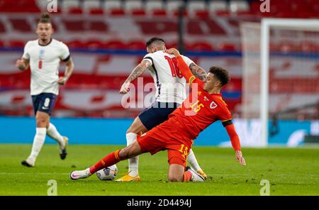 London, UK. 9th Oct, 2020. Wales' Ethan Ampadu (R) vies with England's Danny Ings during a friendly match between England and Wales in London, Britain, on Oct. 8, 2020. Credit: Xinhua/Alamy Live News Stock Photo