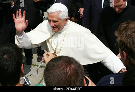 Pope Benedict XVI waves to pilgrims and tourists after a meeting with local priests in Introd, Valle d'Aosta in northern Italy, July 25, 2005. [The pope on Sunday condemned violence in Egypt, Iraq, Turkey and Britain and asked God to stay the hand of terrorists.]