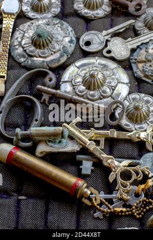 still life of fancy keys and decorative items for sale in a antique store display Stock Photo