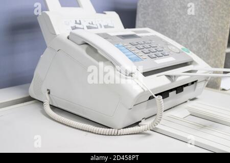 The fax machine use for Sending documents in the office, concept equipment needed in office Stock Photo