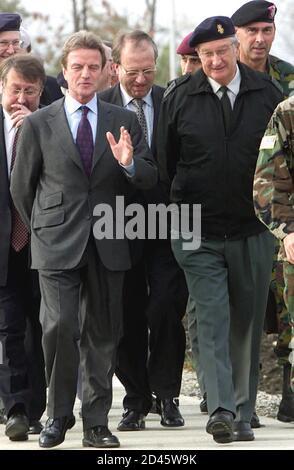 The UN administrator in Kosovo, Bernard Kouchner (L), and Belgium's King Albert II (R), walks on the street in Kosovo's capital of Pristina October 12, 2000. Belgium's King Albert II came to visit some 200 Belgian soldiers based in Macedonia as a part of his' Kosovo tour.