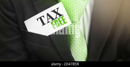 Businessman with Tax free card in upper pocket of his suit. Taxes and fees regulation concept Stock Photo