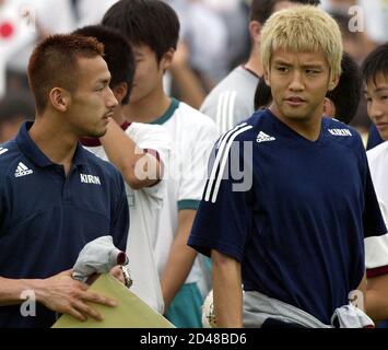 Japanese Soccer Player Junichi Inamoto L Attends A News Conference With Arsenal Manager Arsene Wenger After Signing For Arsenal Football Club July 23 01 Inamoto 21 Signed With Arsenal As A Midfielder