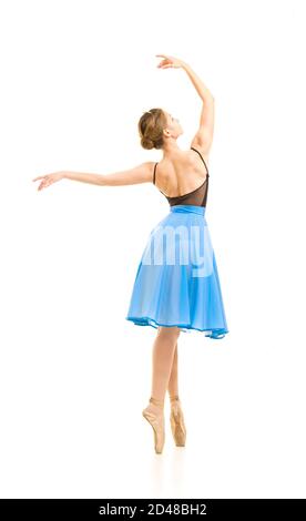 woman in a blue skirt and a black leotard dance ballet. Studio shot on white background , isolated images. Stock Photo