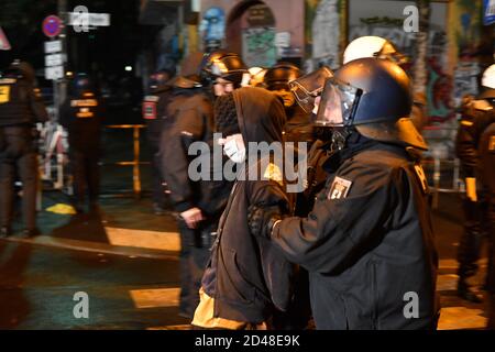 Berlin, Germany. 09th Oct, 2020. Police officers are taking away a demonstrator in Rigaer Street to protest against the eviction of the occupied house 'Liebig 34'. Credit: Paul Zinken/dpa/Alamy Live News Stock Photo
