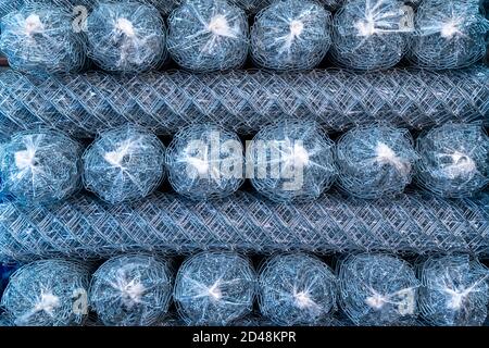 Rolls of steel wire mesh for construction work in warehouse Stock Photo