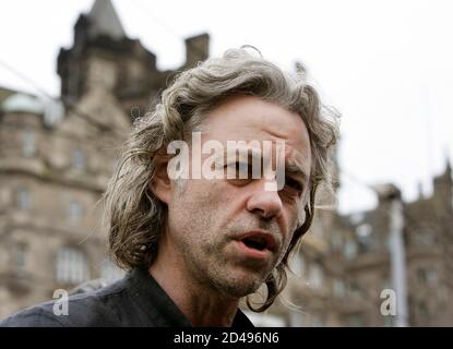 Bob Geldof addresses the media after arriving by train at Waverley station in Edinburgh July 5, 2005. Geldof travelled to Scotland on Tuesday with hundreds of supporters of the Make Poverty History campaign the day before the start of the G8 summit at Gleneagles. REUTERS/Alessandro Bianchi  JJM/NMB/DY