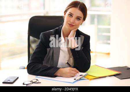 business lady at work. company manager. woman looking through documents in office. professional corporate dresscode Stock Photo