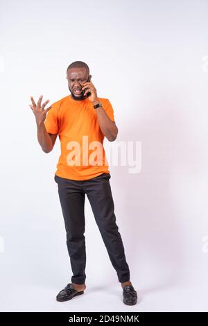 young african making making a phone call quarreling on the phone Stock Photo