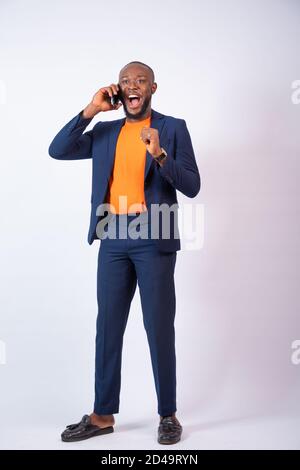 excited business man making a phone call Stock Photo