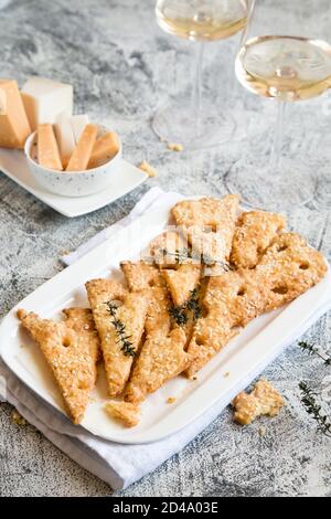 Homemade Cheese Cookies. Cheese cookies, homemade wholesome pastries. Cheese and White Wine. Stock Photo