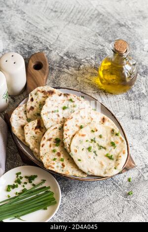 Onion naan - traditional indian bread. pita bread or scones with green onions Stock Photo