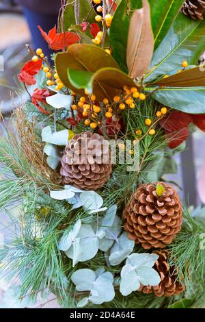 detail of branches of Christmas tree with Christmas decorations hanging Stock Photo