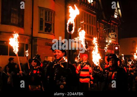 Flaming torches of the street parade Lewes Bonfire celebration in Sussex, UK marking Guy Fawkes night and 17 Protestant martyrs burnt at the stake Stock Photo