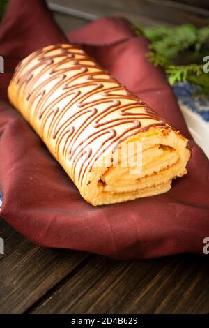 yule log christmas cake on wooden background. Vertical Stock Photo