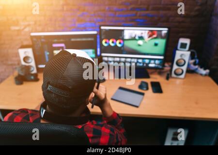 Asian creative man and editor video work Vlogger editing video create content for upload on social media or internet online connect communication peop Stock Photo