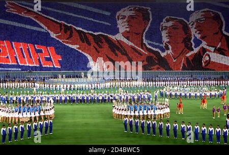 North Korean soldiers, workers and students rehearse for a mass gymnastics display of 100,000 performers at the May Day stadium in Pyongyang March 29, 2002. The Arirang Festival, dubbed the 'greatest gymnastic performance of the 21st century', will be held April 29 to June 29 in the North Korean capital. North Korean officials denied the festival was designed to upstage the World Cup soccer finals being held in South Korea and Japan May 31-June 30. Picture taken March 29, 2002. REUTERS/Guang Niu  ASW/RCS