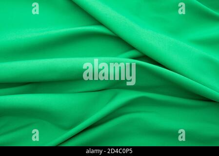 Wavy green fabric, cloth fabric texture or background, high resolution Stock Photo