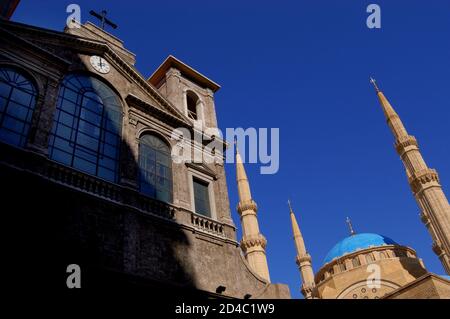 View of the Saint George Maronite Cathedral and Mohammad al-Amin Mosque in Downtown Beirut. Stock Photo