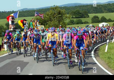 Lampre team riders lead the pack through the German countryside during  the 181km second stage of  the 89th Tour de France cycling race from [Luxembourg city] to Saarbrucken in Germany July 8, 2002. [Mapei team rider Oscar Freire of Spain won the stage in a sprint and  Lampre team rider Rubens Bertoglati of Switzerland retains the yellow leader jersey.]