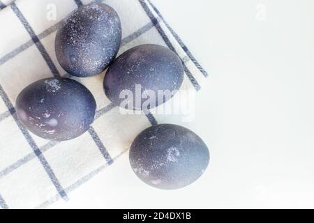 Blue easter eggs on a white checked towel Stock Photo