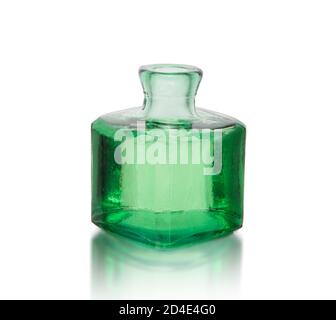 Old green glass Ink well, vintage - isolated. Stock Photo
