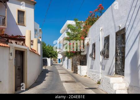 Old cozy street with flowers in white houses in Bodrum, Turkey Stock Photo