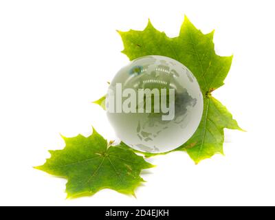 World globe with green leaves isolated on white background Stock Photo