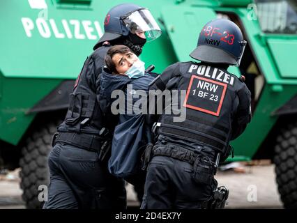 Berlin, Germany. 09th Oct, 2020. A demonstrator is led away by police on the day of the evacuation of the occupied house 'Liebig 34'. Credit: Fabian Sommer/dpa/Alamy Live News Stock Photo