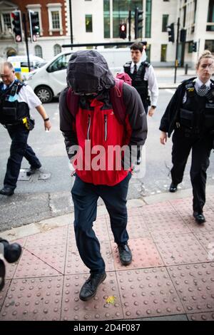 Benjamin Clark, 18, of Wilton Crescent, Hertford, exits Westminster Magistrates' Court in London, charged with criminal damage to the Sir Winston Churchill statue in Parliament Square on September 10, the final day of ten days of Extinction Rebellion protests in the capital and admitted causing £1,642.03 worth of damage to the statue and spraying the word 'racist' in chalk paint, but denied causing all the damage to the statue done on the day. Deputy Chief Magistrate Tan Ikram handed down a £200 fine and ordered Clark to pay £1,200 in compensation. Stock Photo