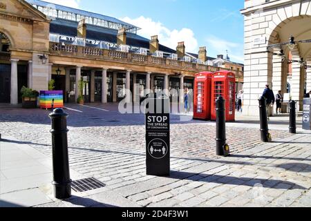 Stop The Spread Of Coronavirus social distancing street sign in Covent Garden, London 2020 Stock Photo