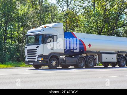 big gas-tank truck goes on highway Stock Photo