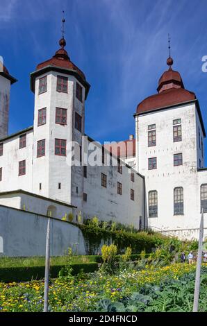 View of historic garden and Baroque Läckö Castle on Kållandsö in Lake Vänern in Västergötland, Sweden.