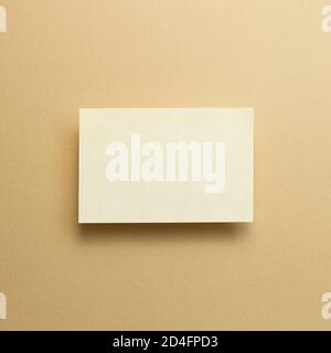 Blank memo pad, empty paper on beige background. top view, copy space Stock Photo