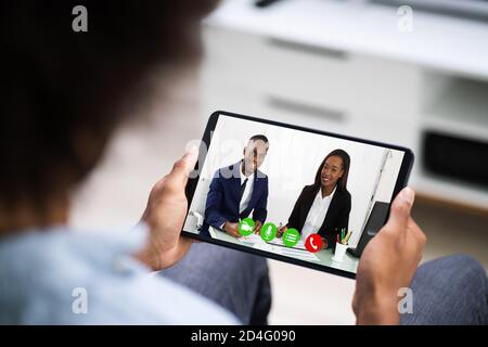 Man In Video Conferencing Call On Tablet. Webinar Conference Stock Photo