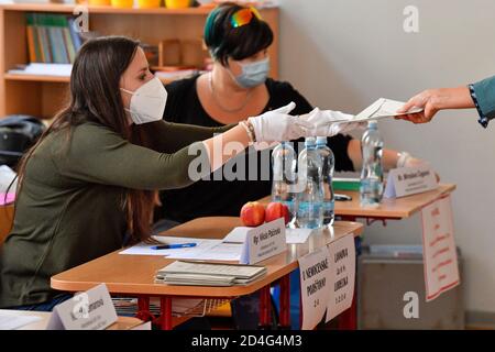 Prague, Czech Republic. 09th Oct, 2020. People vote during the first day of second round of Senate election in Prague, Czech Republic, October 9, 2020. Credit: Michal Kamaryt/CTK Photo/Alamy Live News Stock Photo